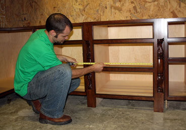 Ryan measures a cabinet